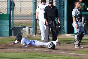 Lemoore's Seth Wong steals home in Wednesday's 10-2 win over Dinuba.